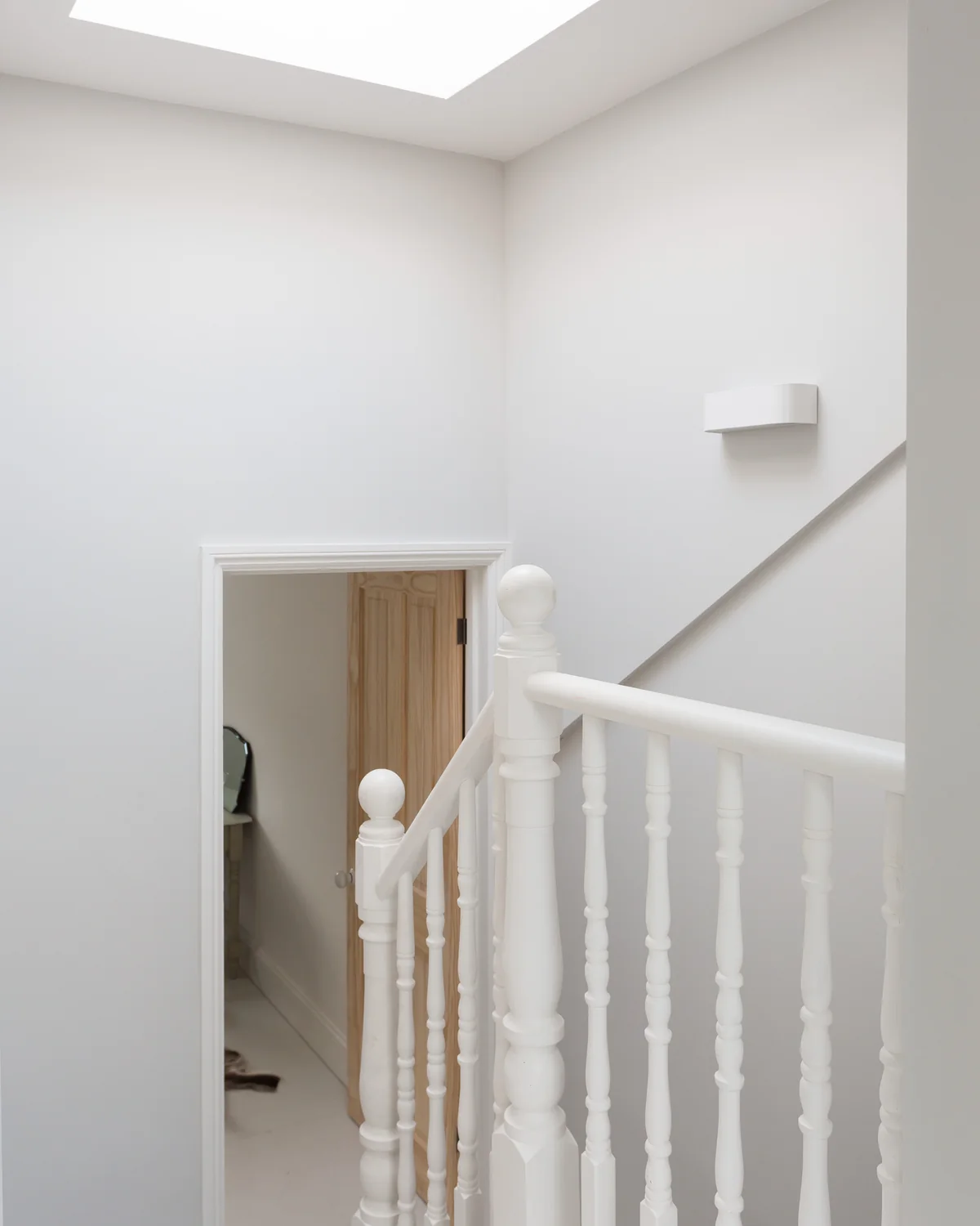 Loft staircase in a Woking home, showing the stair rising into the converted roof space.